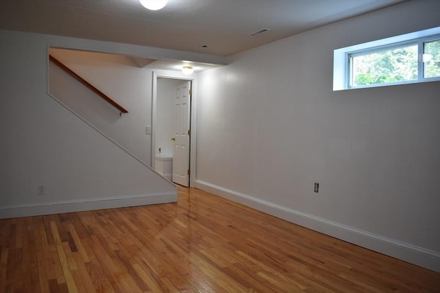 basement featuring hardwood / wood-style flooring