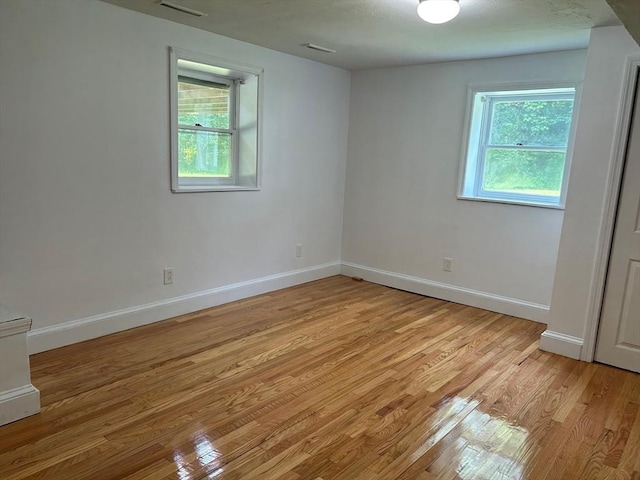 spare room with light wood-type flooring