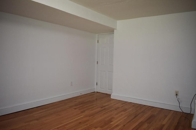 empty room with hardwood / wood-style floors