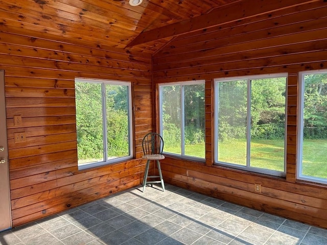 unfurnished sunroom with wooden ceiling, a wealth of natural light, and vaulted ceiling