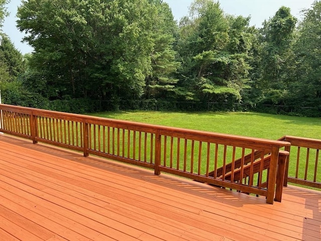 wooden deck with a lawn