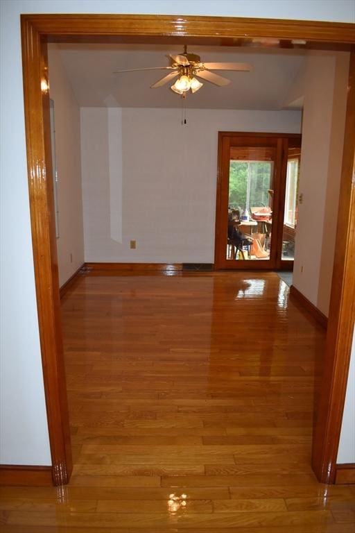 unfurnished room with ceiling fan and light hardwood / wood-style flooring