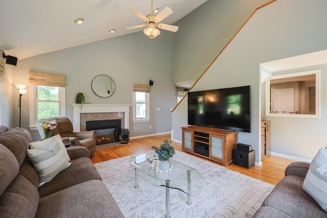 70 Huntsbridge Rd, North Attleboro, MA 02760 - living area featuring high vaulted ceiling, wood finished floors, a fireplace with flush hearth, and ceiling fan