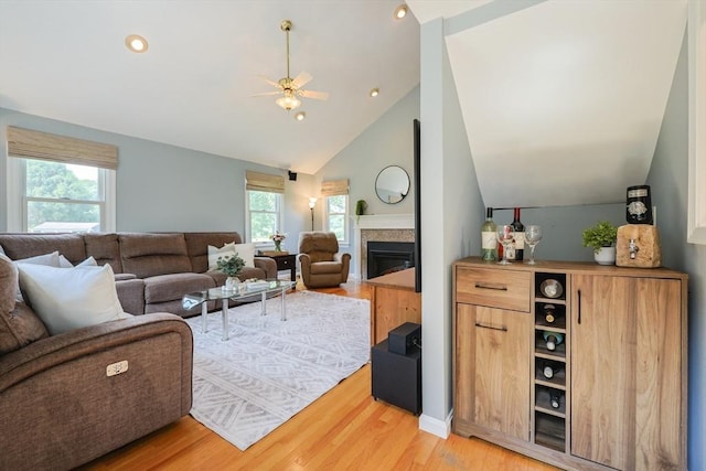 70 Huntsbridge Rd, North Attleboro, MA 02760 - living area featuring vaulted ceiling, a glass covered fireplace, light wood-style flooring, a ceiling fan, and recessed lighting