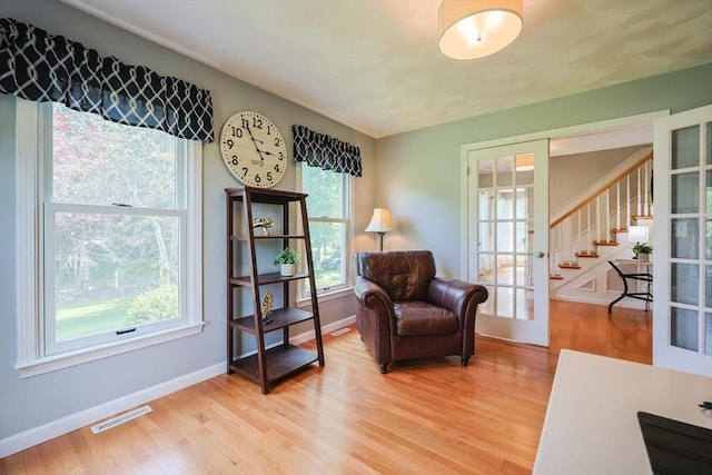 70 Huntsbridge Rd, North Attleboro, MA 02760 - living area with light wood-style floors and stairway