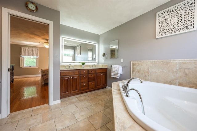 70 Huntsbridge Rd, North Attleboro, MA 02760 - full bathroom with double vanity, a bath, and a ceiling fan