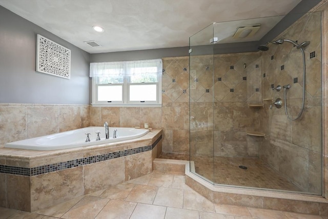 70 Huntsbridge Rd, North Attleboro, MA 02760 - bathroom with a bath, a tile shower, and tile patterned floors