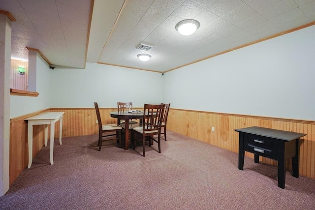 70 Huntsbridge Rd, North Attleboro, MA 02760 - dining space featuring a wainscoted wall, carpet flooring, wooden walls, and crown molding