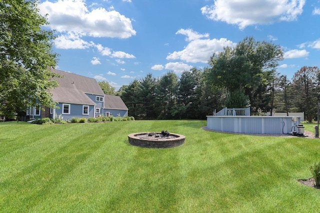 70 Huntsbridge Rd, North Attleboro, MA 02760 - view of grassy yard with a swimming pool and a fire pit