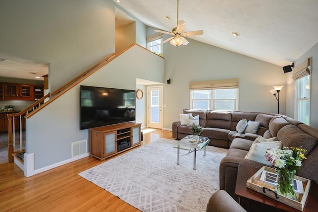 70 Huntsbridge Rd, North Attleboro, MA 02760 - living area featuring high vaulted ceiling, ceiling fan, stairs, and wood finished floors