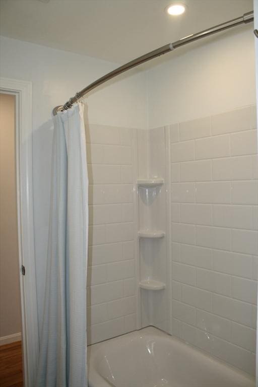 bathroom featuring recessed lighting and shower / tub combo with curtain