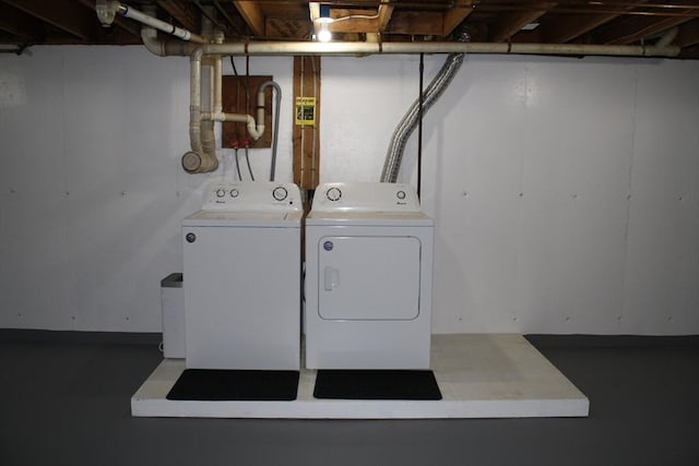 clothes washing area with laundry area and washing machine and clothes dryer