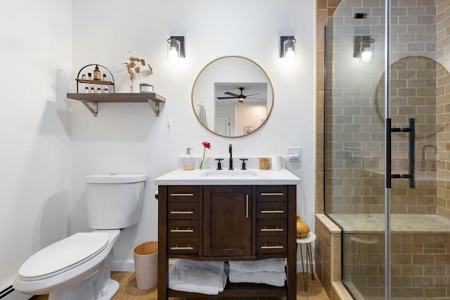 full bath with toilet, ceiling fan, a shower stall, and vanity