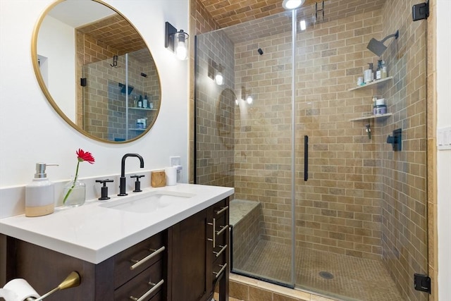 full bath with vanity and a shower stall