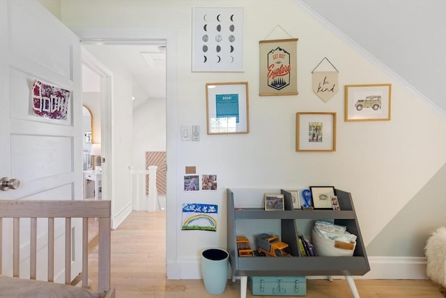 interior space featuring baseboards and wood finished floors