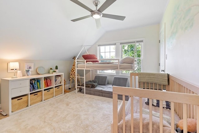 bedroom with carpet and lofted ceiling