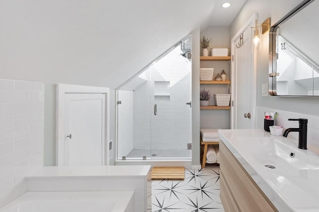 full bathroom with a garden tub, tile patterned floors, a stall shower, and vanity