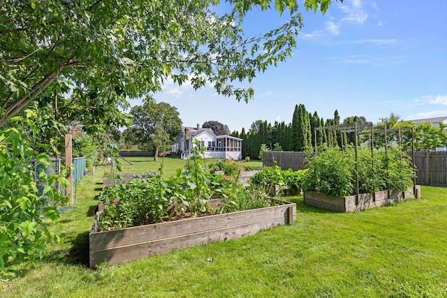 view of yard with a garden and fence
