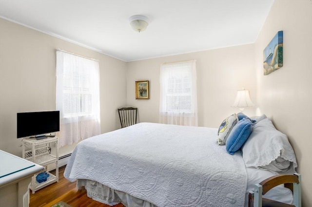 68 Fifth Ave, Barnstable, MA 02601 - bedroom with multiple windows, wood finished floors, and ornamental molding