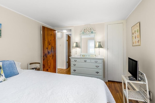 68 Fifth Ave, Barnstable, MA 02601 - bedroom with dark wood-style floors, ornamental molding, and a wall mounted AC