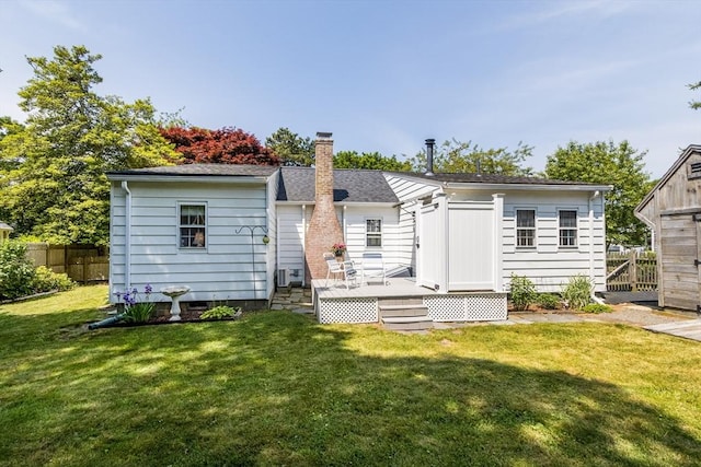 68 Fifth Ave, Barnstable, MA 02601 - rear view of house featuring a deck and a chimney