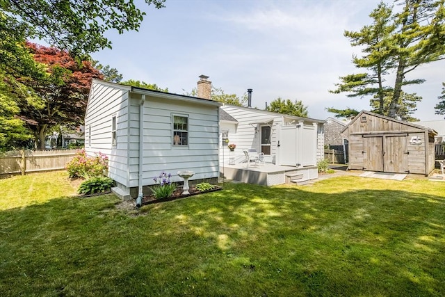 68 Fifth Ave, Barnstable, MA 02601 - back of house featuring a chimney, a storage shed, and a wooden deck
