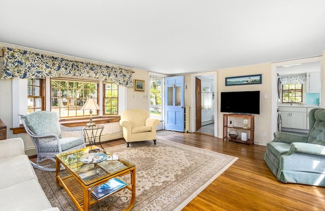 68 Fifth Ave, Barnstable, MA 02601 - living room with wood finished floors and a baseboard radiator