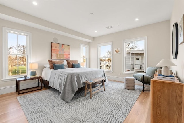 60 Williams St Unit 302, Boston, MA 02130 - bedroom featuring light wood-style flooring, baseboards, multiple windows, and visible vents