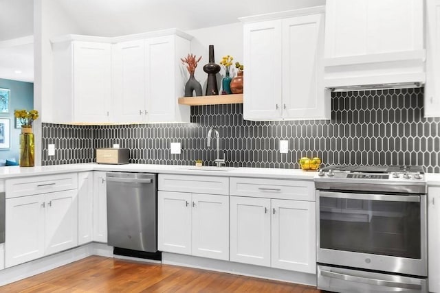 34 Alpha Rd Unit 3, Boston, MA 02124 - kitchen with stainless steel appliances, a sink, light countertops, and white cabinets