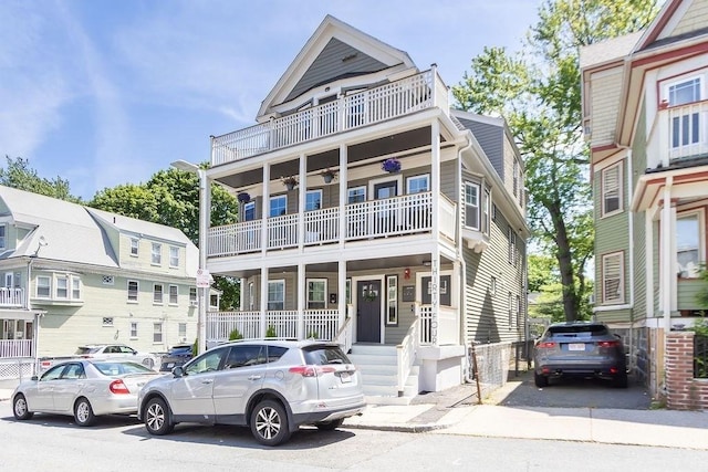 34 Alpha Rd Unit 3, Boston, MA 02124 - view of front of house with a balcony and a porch