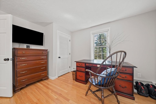 office with baseboards and light wood finished floors