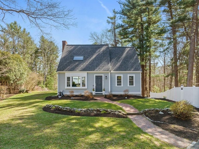 cape cod home with a chimney, a front lawn, and fence