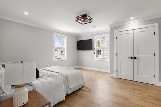 1 Wall St, Quincy, MA 02169 - bedroom with ornamental molding, multiple windows, light wood-type flooring, recessed lighting, and a closet