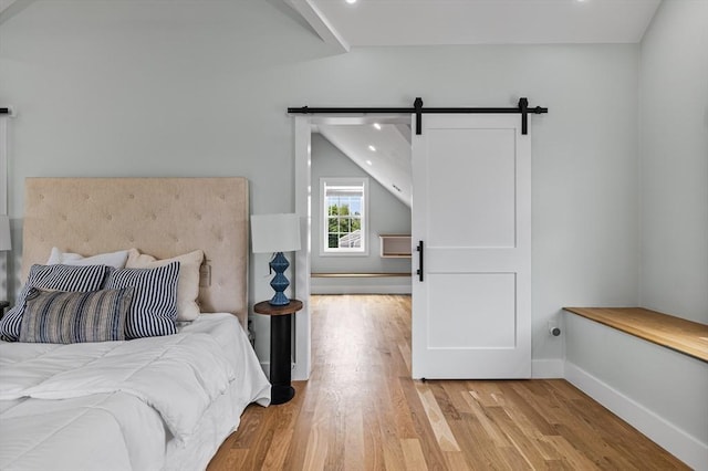 1 Wall St, Quincy, MA 02169 - bedroom featuring a barn door, wood finished floors, and recessed lighting