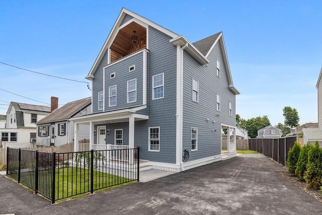 1 Wall St, Quincy, MA 02169 - view of front of house with a porch, a fenced front yard, and asphalt driveway