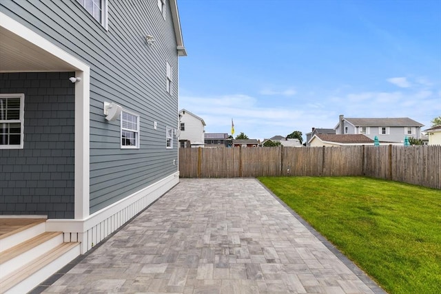 1 Wall St, Quincy, MA 02169 - fenced backyard featuring a patio area
