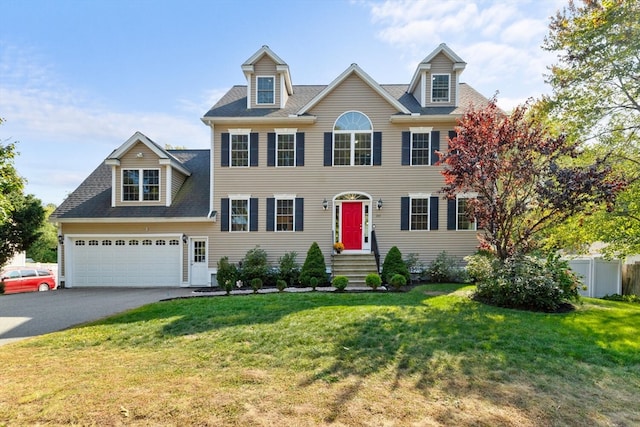 colonial-style house with a garage and a front yard