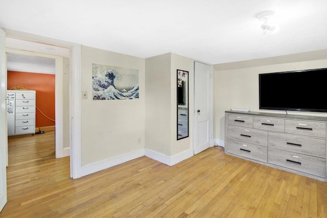 unfurnished living room with light hardwood / wood-style floors