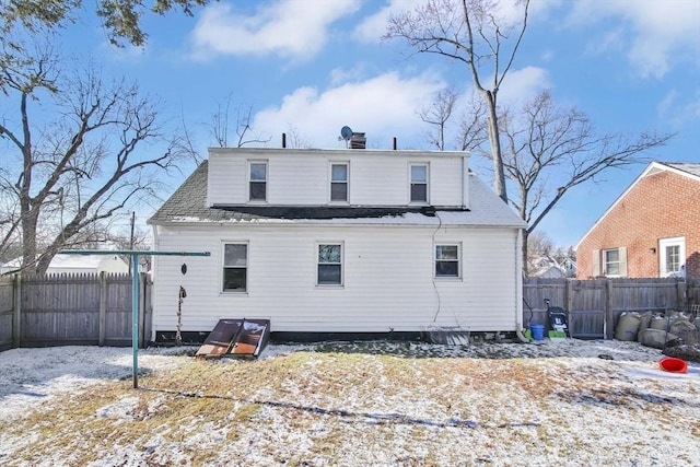 view of snow covered house