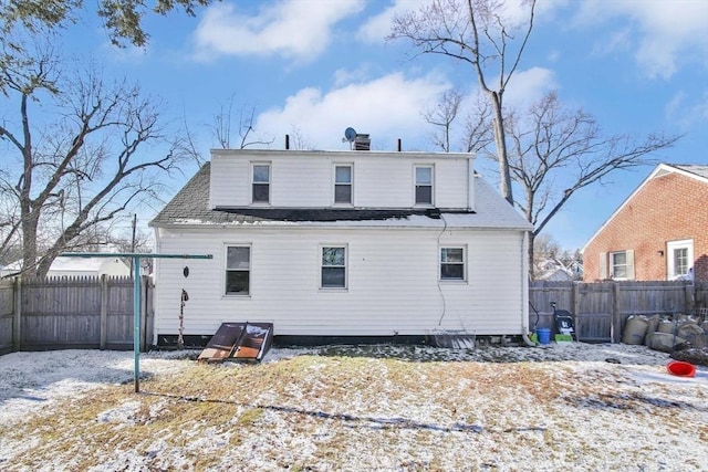 view of snow covered house