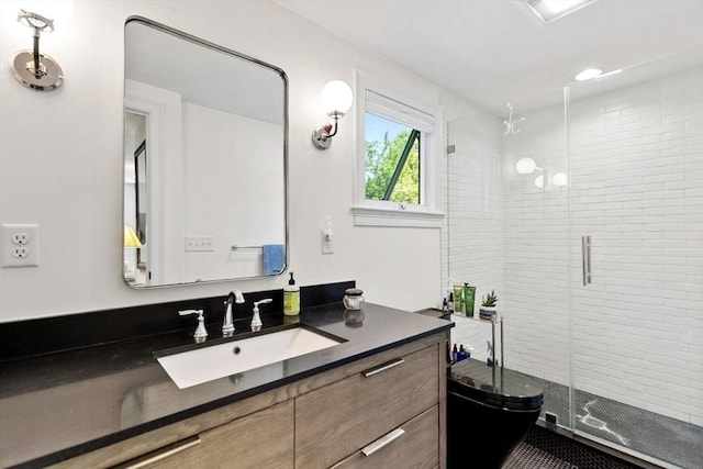 bathroom featuring vanity and a shower stall