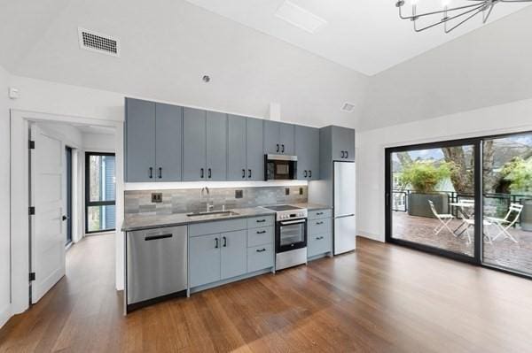 kitchen with plenty of natural light, visible vents, stainless steel appliances, and a sink