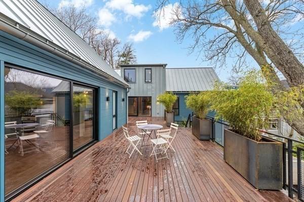 wooden deck featuring outdoor dining area