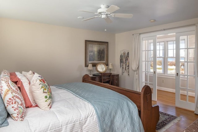 bedroom featuring ceiling fan, french doors, and hardwood / wood-style floors