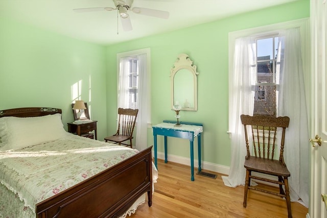 bedroom featuring ceiling fan and light wood-type flooring