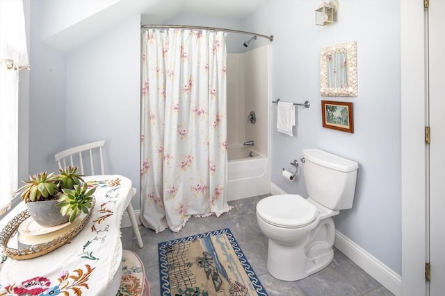 bathroom with shower / bath combination with curtain, vaulted ceiling, and toilet