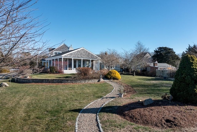 view of yard featuring a sunroom