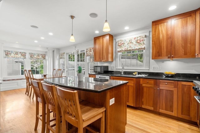 12 Moreland Rd, Quincy, MA 02169 - kitchen with brown cabinets, light wood-style flooring, and recessed lighting