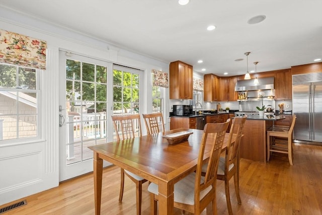 12 Moreland Rd, Quincy, MA 02169 - dining space with light wood-style flooring, ornamental molding, and recessed lighting
