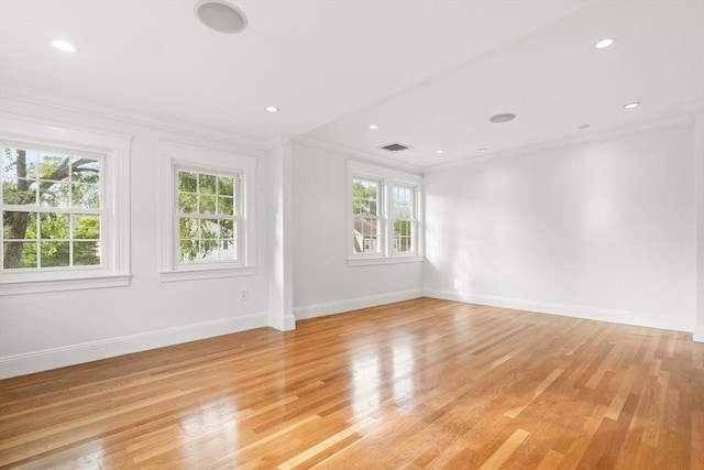 12 Moreland Rd, Quincy, MA 02169 - empty room with plenty of natural light, ornamental molding, light wood-type flooring, and recessed lighting